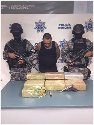 Arrestan a sujeto con 20 kilos de marihuana y un arma de fuego
